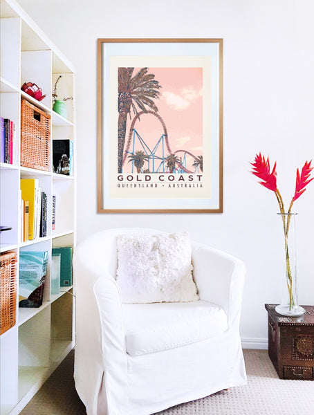 Gold Coast roller coaster with palms poster print in wooden frame with armchair