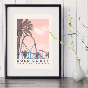 Gold Coast poster roller coaster with palm in black frame with white vase